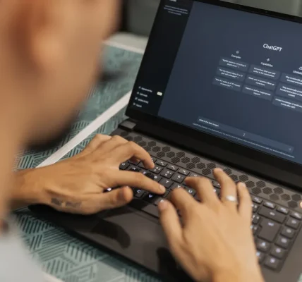 person using a laptop with the ChatGPT interface