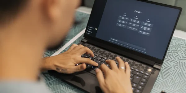 person using a laptop with the ChatGPT interface