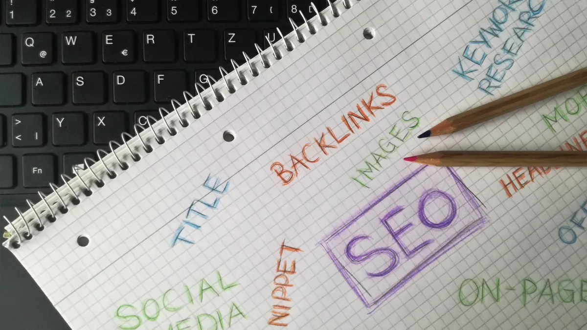 Notebook with SEO keywords and backlinks written around a central SEO box